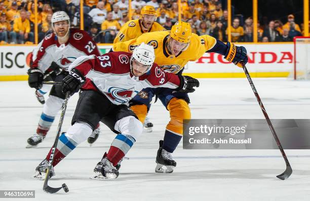 Matt Nieto of the Colorado Avalanche skates the puck in the zone against Kyle Turris of the Nashville Predators in Game Two of the Western Conference...