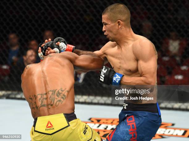 John Moraga punches Wilson Reis of Brazil in their flyweight fight during the UFC Fight Night event at the Gila Rivera Arena on April 14, 2018 in...