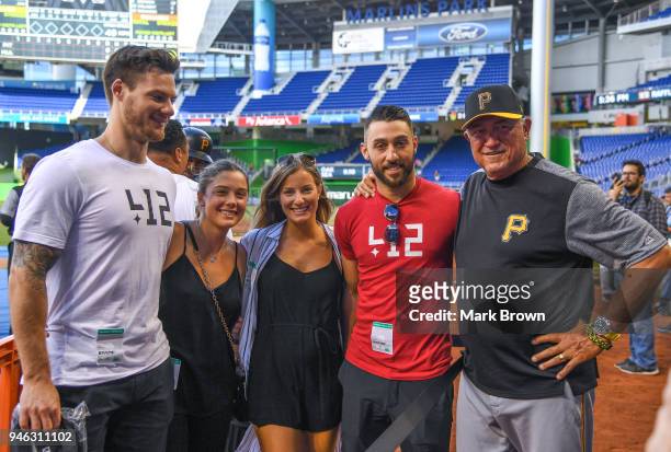 Florida Panthers center Vincent Trocheck and guests pose with Manager Clint Hurdle of the Pittsburgh Pirates before the game against the Miami...