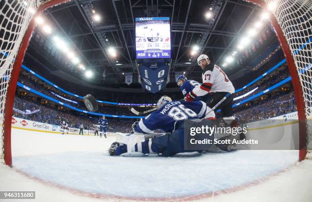 Andrei Vasilevskiy of the Tampa Bay Lightning lets up a goal against Patrick Maroon and the New Jersey Devils in Game Two of the Eastern Conference...