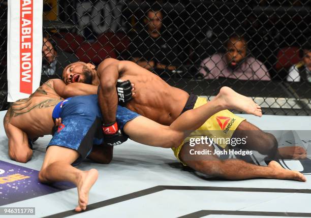 Wilson Reis of Brazil takes down John Moraga in their flyweight fight during the UFC Fight Night event at the Gila Rivera Arena on April 14, 2018 in...