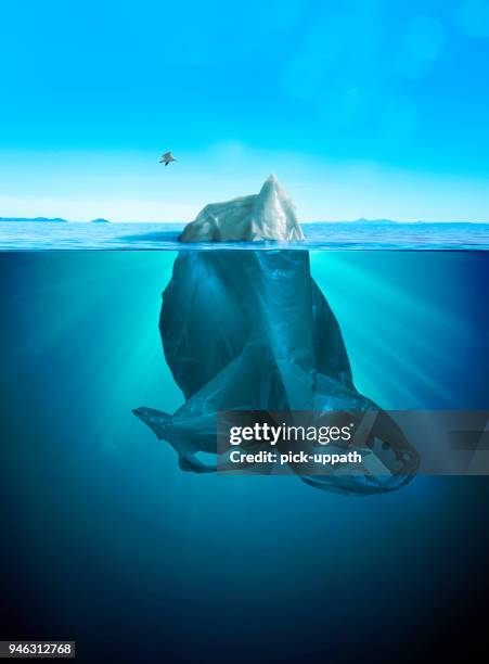 iceberg of trash - half full stock pictures, royalty-free photos & images