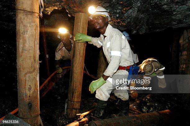 Mines work underground at Anglo Gold Ashanti's Mponeng gold mine near Carltonville, South Africa, Thursday, May 25, 2006.