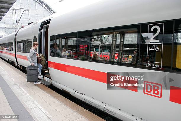 Passenger boards an Intercity Express at the central railway station in Frankfurt, Germany, Friday, August 11, 2006.