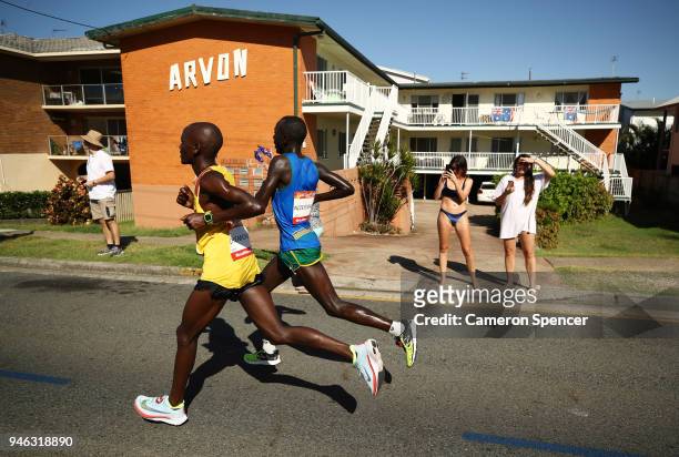 Spectators watch from roadside during the Men's marathon on day 11 of the Gold Coast 2018 Commonwealth Games at Southport Broadwater Parklands on...