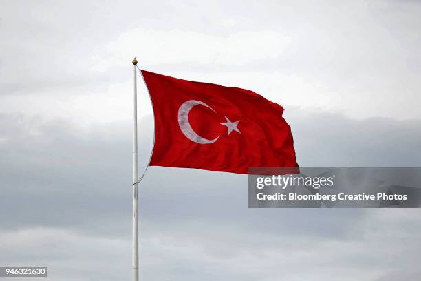 a turkish national flag flies in istanbul - bandera turca fotografías e imágenes de stock
