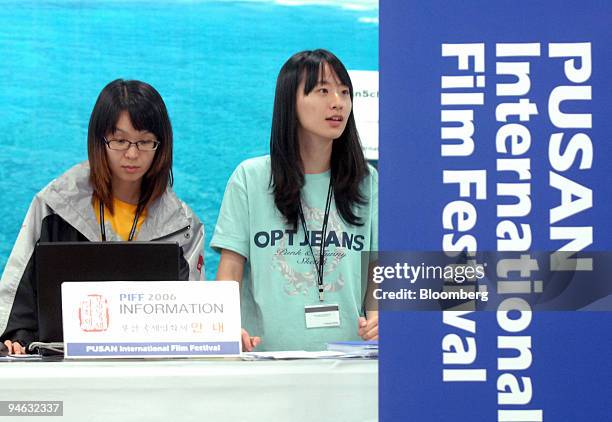 Employees of the Pusan International Film Festival prepare for the festival's opening at the Kimhae Airport in Pusan, South Korea, on Wednesday,...