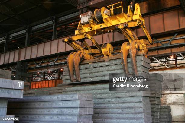 Semi-finished steel slabs, still hot enough to be unapproachable, at the Presidente Vargas plant of the Companhia Siderurgica Nacional, CSN, steel...