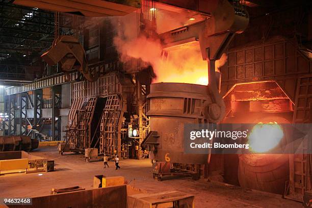 Ladle filled with liquid pig iron approaches a furnace at the Presidente Vargas plant of the Companhia Siderurgica Nacional, CSN, steel factory in...