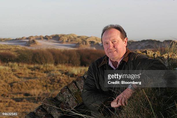 Neil Hobday, project director of Trump International Golf Links, Scotland poses on land where Donald Trump is planning to open a golf course and...