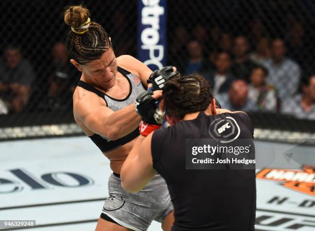 Cortney Casey punches Michelle Waterson in their womens strawweight fight during the UFC Fight Night event at the Gila Rivera Arena on April 14, 2018...