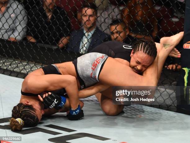 Cortney Casey attempts to submit Michelle Waterson in their womens strawweight fight during the UFC Fight Night event at the Gila Rivera Arena on...