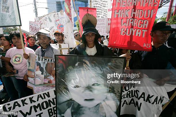 Protesters take part in a demonstration against Richard Ness, president director of Newmont Mining Corp.'s local unit, outside the Manado Court, in...