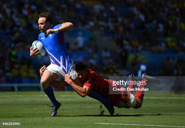 Ruaridh Jackson of Scotland is tackled by Justin Tipuric of Wales during the Rugby Sevens Men's Placing 5-8th match between Scotland and Wales on day...