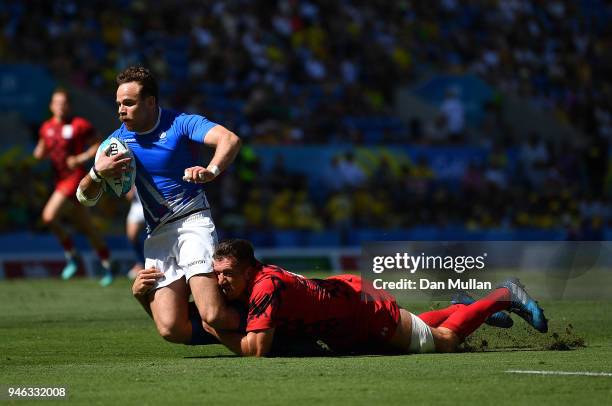 Ruaridh Jackson of Scotland is tackled by Justin Tipuric of Wales during the Rugby Sevens Men's Placing 5-8th match between Scotland and Wales on day...