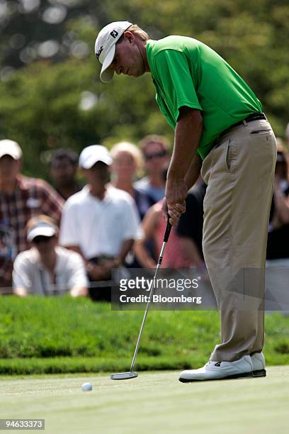 Golfer Steve Stricker sinks a birdie putt on the 3rd hole during the Barclays Classic golf tournament at Westchester Country Club in Rye, New York,...