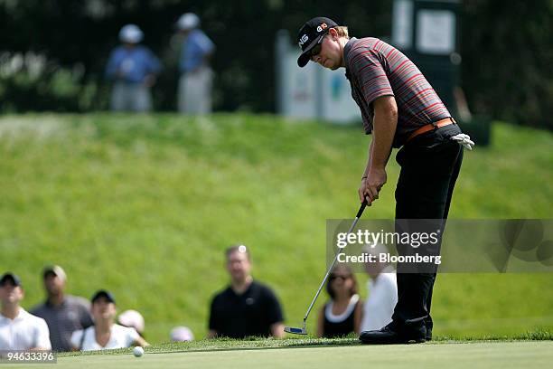 Golfer Hunter Mahan sinks a birdie putt on the 16th green during the third round of the Barclays Classic golf tournament at Westchester Country Club...