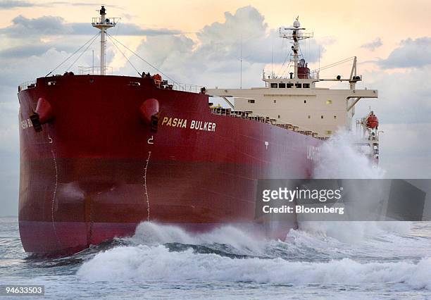 Waves crash against the coal freighter Pasha Bulker, which ran around at the entrance to Newcastle Port, north of Sydney, Australia, on Tuesday, June...