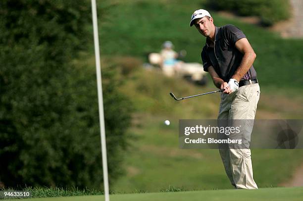 Golfer Geoff Ogilvy hits out of the rough on the 14th hole during the third round of the Barclays Classic golf tournament at Westchester Country Club...