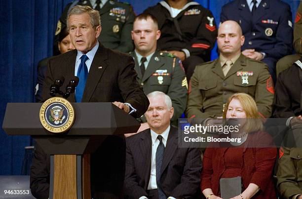 Robert Gates, center, and his wife Becky Gates, right, listen to U.S. President George Bush as he addresses Pentagon staff, Congressional leaders,...