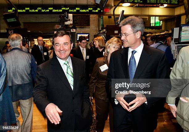 James Michael Flaherty, left, Canadian Minister of Finance, is accompanied by Jeffrey Eubank, right, vice president for global affairs at the NYSE,...