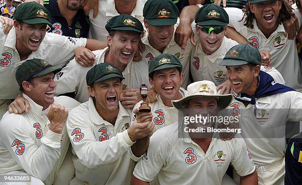 The Australian cricket team celebrate after claiming victory against England in reclaiming the Ashes trophy, on day 5 of the third Ashes Test match...