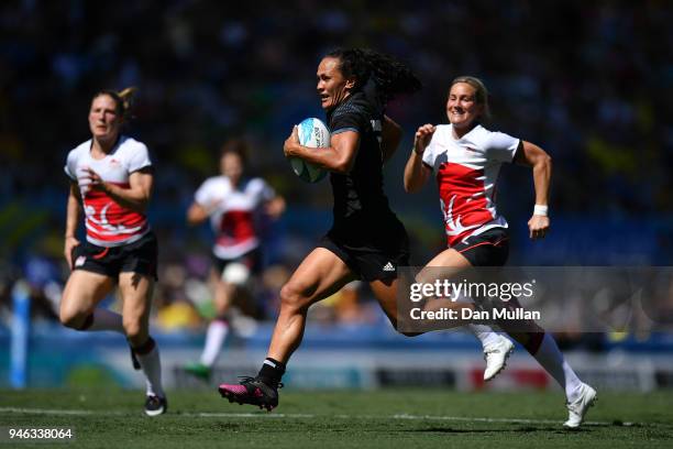 Portia Woodman of New Zealand makes a break during the Rugby Sevens Women's Semi-Final between New Zealand and England on day 11 of the Gold Coast...