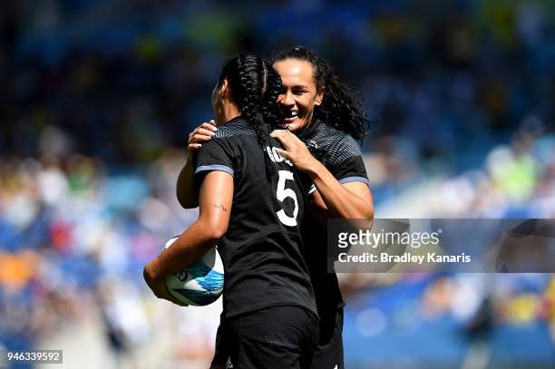 Sarah Goss of New Zealand celebrates with team mate Portia Woodman after scoring a try in the match between New Zealand and England during Rugby...
