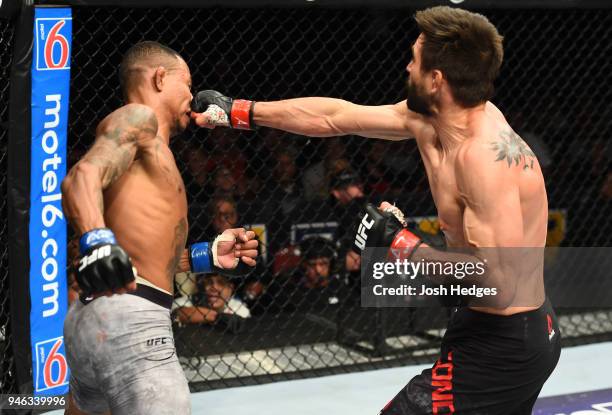 Carlos Condit punches Alex Oliveira of Brazil in their welterweight fight during the UFC Fight Night event at the Gila Rivera Arena on April 14, 2018...