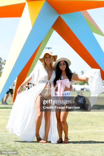 Festivalgoers pose in front of Art installation SUPERNOVA by R&R Studios during 2018 Coachella Valley Music And Arts Festival Weekend 1 at the Empire...