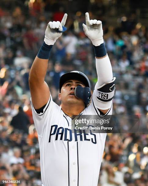 Christian Villanueva of the San Diego Padres celebrates after hitting a solo home run during the first inning of a baseball game against the San...