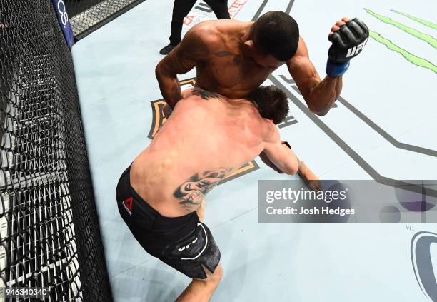 Alex Oliveira of Brazil elbows Carlos Condit in their welterweight fight during the UFC Fight Night event at the Gila Rivera Arena on April 14, 2018...