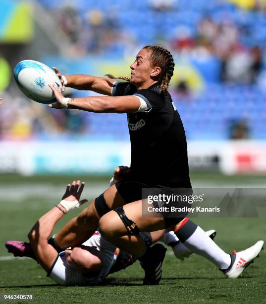 Niall Williams of New Zealand passes the ball in the match between New Zealand and England during Rugby Sevens on day 11 of the Gold Coast 2018...