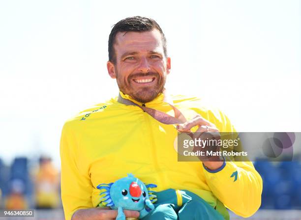 Gold medalist Kurt Fearnley of Australia celebrates during the medal ceremony for the Mens T54 marathon on day 11 of the Gold Coast 2018...