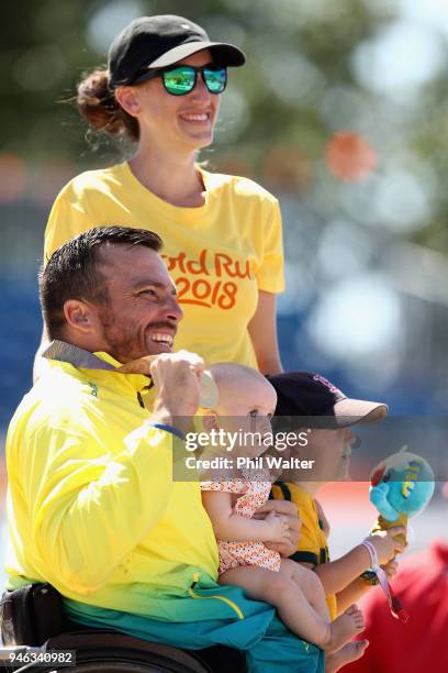 Kurt Fearnley of Australia celebrates on the podium with his Wife Sheridon, Son Harry and Daughter Emilia following gold in the men's T54 marathon on...