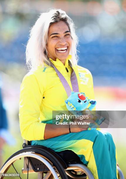 Madison de Rozario of Australia celebrates on the podium following her gold medal in the women's T54 final on day 11 of the Gold Coast 2018...