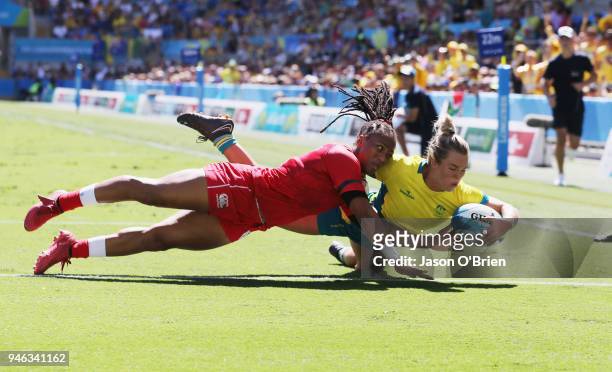 Australia's Emma Tonegato scores a try against Canada in the Women's Semi Finals during Rugby Sevens on day 11 of the Gold Coast 2018 Commonwealth...