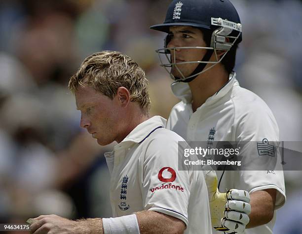 Ian Bell, left, batting for England, gets a pat on the back from team mate Alastair Cook, as they leave the field, on day 4 of the third Ashes Test...