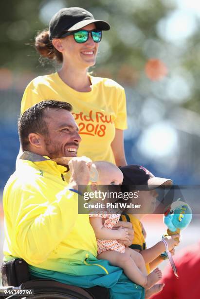 Kurt Fearnley of Australia celebrates on the podium with his Wife Sheridon, Son Harry and Daughter Emilia following gold in the men's T54 marathon on...