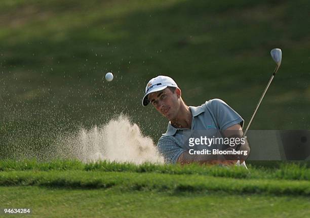 Professional golfer Geoff Ogilvy hits out of the bunker on the 9th hole of the Barclays Classic tournament at Westchester Country Club in Rye, New...