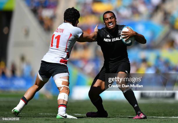 Sione Molia of New Zealand takes on Ethan Waddleton of England during the Rugby Sevens Men's Semi-Final between England and New Zealand on day 11 of...