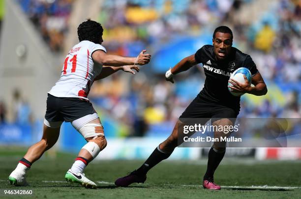 Sione Molia of New Zealand takes on Ethan Waddleton of England during the Rugby Sevens Men's Semi-Final between England and New Zealand on day 11 of...