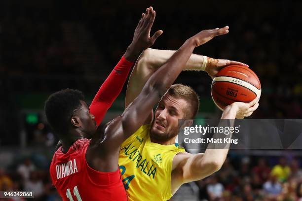Australia forward Jesse Wagstaff and Canada forward/guard Mambi Diawara compete during the Men's Gold Medal Basketball Game between Australia and...