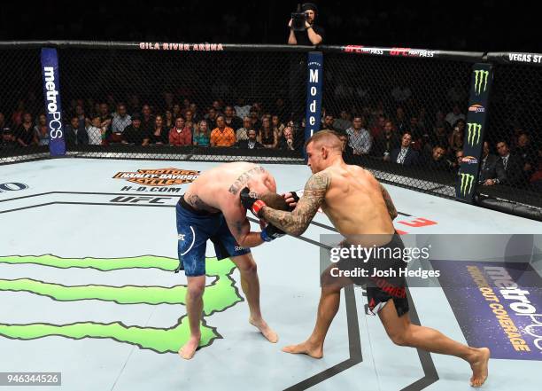 Dustin Poirier punches Justin Gaethje in their lightweight fight during the UFC Fight Night event at the Gila Rivera Arena on April 14, 2018 in...