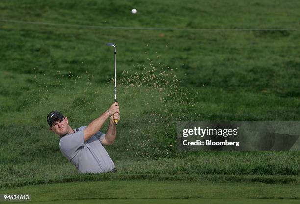 Professional golfer Rory Sabbatini hits out of the bunker on the 3rd hole of the Barclays Classic tournament at Westchester Country Club in Rye, New...