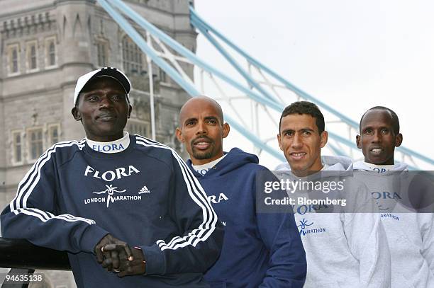 Elite marathoners Felix Limo, left, of Kenya, Meb Keflezighi, of USA, Khalid Khannouchi, of USA, and Martin Lel, of Kenya, pose for a photograph near...