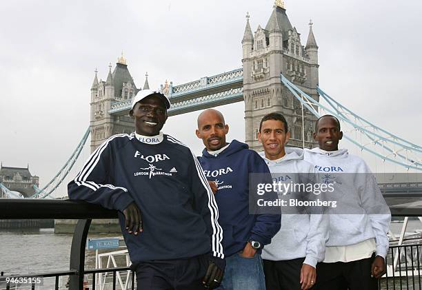 Elite marathoners Felix Limo, left, of Kenya, Meb Keflezighi, of USA, Khalid Khannouchi, of USA, and Martin Lel, of Kenya, pose for a photograph near...