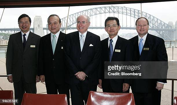 Tsukasa Kawada, Japan's consulate general in Australia, left, Mitsunori Torihara, president of Tokyo Gas Co., second left, John Howard, Australia's...