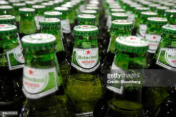 Bottles of Heineken beer on the production line at the Heineken brewery in Zoeterwoude, The Netherlands, Thursday, Aug. 23, 2007. The head on...