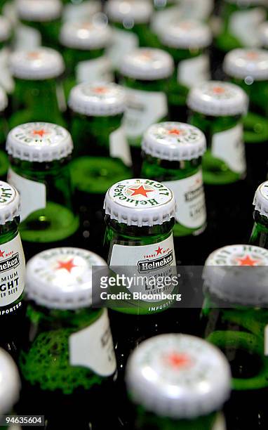 Bottles of Heineken light beer on the production line at the Heineken brewery in Zoeterwoude, The Netherlands, Thursday, Aug. 23, 2007. The head on...